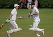Perranarworthal batsman pass on the wicket. Left is Malcolm Thomas, right is Jimmy Spiers.